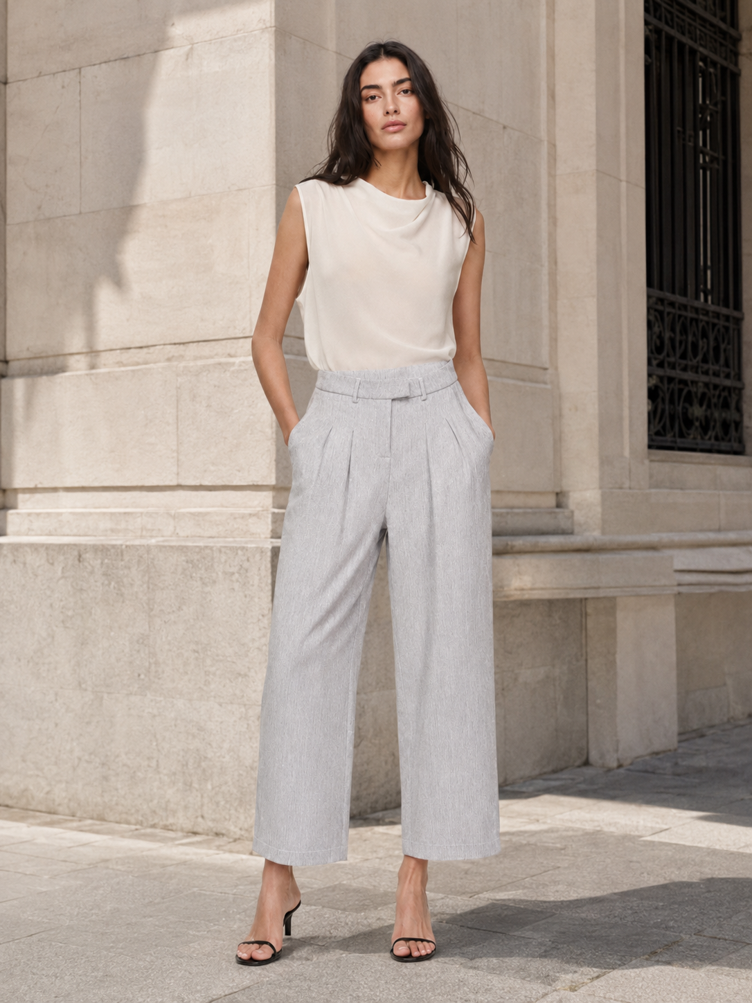 Sophisticated High-Waisted Pleated Wide-Leg Trousers with Structured Waistband and Elegant Tailored Silhouette
